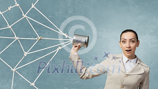 Young pretty businesswoman attaching tin phone to ear Young pretty businesswoman attaching tin phone to ear