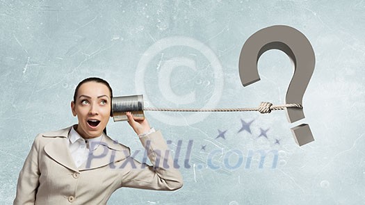 Young pretty businesswoman attaching tin phone to ear