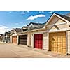 Row of garage doors at parking area for townhouses