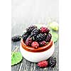 Ripe mulberry berries in a bowl, freshly picked