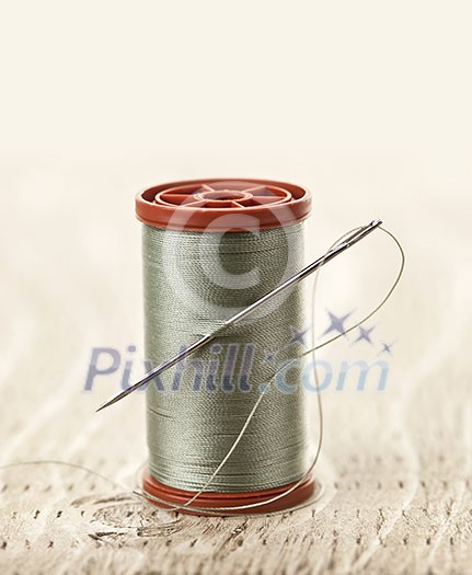Spool of thread with needle for sewing Spool of thread with needle for sewing