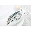 Elegant restaurant table setting for fine dining with plates cutlery and stemware