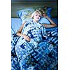 Young woman sleeping peacefully at night in bed