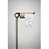 Metal stand with empty toilet paper roll