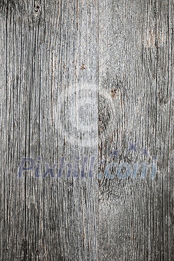 Weathered distressed rustic barn wood as textured background Weathered distressed rustic barn wood as textured background