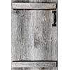 Distressed rustic barn wood door with handle as textured background