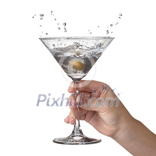 Martini with splash and olive in womans hand isolated on white Martini with splash and olive in womans hand isolated on white