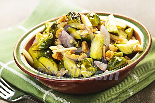 Vegetarian bowl of roasted brussels sprouts with walnuts Vegetarian bowl of roasted brussels sprouts with walnuts