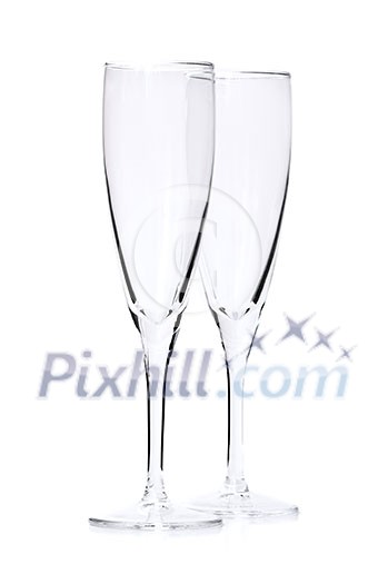 Two empty champagne flutes isolated on white background Two empty champagne flutes isolated on white background