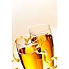 Two full champagne flutes with sparkling wine and ribbon
