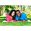 Young romantic couple enjoying summer day in park