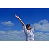 healthy Happy  young woman with spreading arms, blue sky with clouds in background  - copyspace