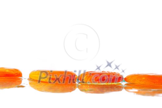isolated wet zen stones with splashing water drops representing concept of natural balance and perfect harmony isolated wet zen stones with splashing water drops representing concept of natural balance and perfect harmony