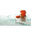 isolated wet zen stones with splashing  water drops  representing concept of natural balance and perfect harmony