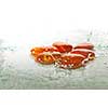 isolated wet zen stones with splashing  water drops  representing concept of natural balance and perfect harmony