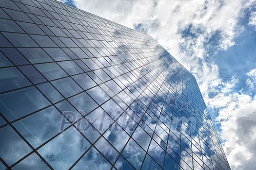 Modern building with reflection of blue sky and clouds Modern building with reflection of blue sky and clouds