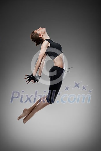 jumping young dancer on black jumping young dancer on black
