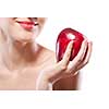 Portrait of smiling woman holding red apple isolated on white