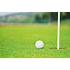 golf ball on sports golf course and hole