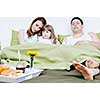 happy young family eat breakfast in bed at morning 