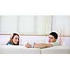 happy young couple relax at home in modern and bright living room 