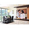 happy young couple have fun in modern wooden  kitchen indoor while preparing fresh food