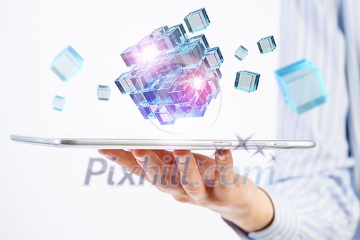 Businessman holding tablet and cube as symbol of problem solving Businessman holding tablet and cube as symbol of problem solving