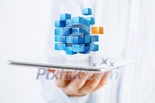 Businessman holding tablet and cube as symbol of problem solving Businessman holding tablet and cube as symbol of problem solving