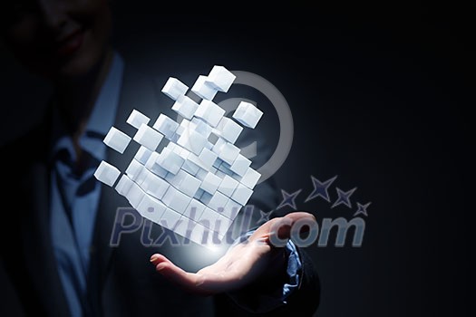 Businesswoman hand shows cube as symbol of problem solving Businesswoman hand shows cube as symbol of problem solving