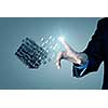 Businessman hand touch cube as symbol of problem solving