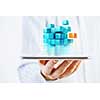 Businessman holding tablet and cube as symbol of problem solving
