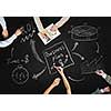 Top view of people hands drawing business teamwork strategy