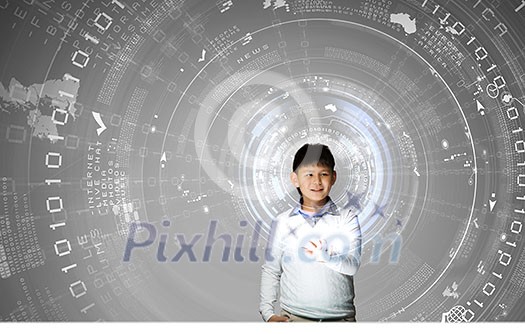 Young asian boy at lesson touching media screen Young asian boy at lesson touching media screen