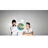 Woman teacher and boy at lesson touching media screen. Elements of this image are furnished by NASA