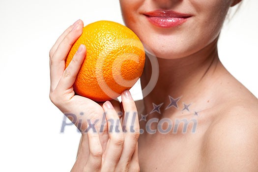 Young woman with orange isolated on white Young woman with orange isolated on white