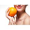 Young woman with orange isolated on white