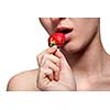 Young woman biting strawberry isolated on white