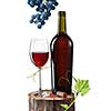 Glass of red wine, bottle and grape on stump isolated on white