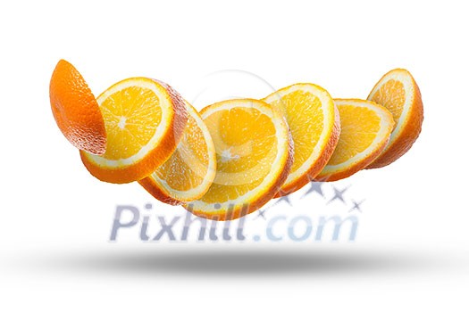 Falling slices of orange in air isolated on white