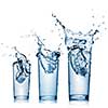 water splash in glasses isolated on white