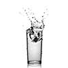 water splash in glass isolated on white