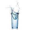 water splash in glass isolated on white