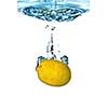 Fresh lemon dropped into water with bubbles isolated on white