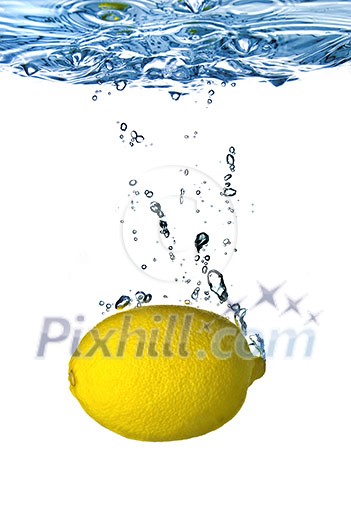Fresh lemon dropped into water with bubbles isolated on white Fresh lemon dropped into water with bubbles isolated on white