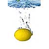 Fresh lemon dropped into water with bubbles isolated on white