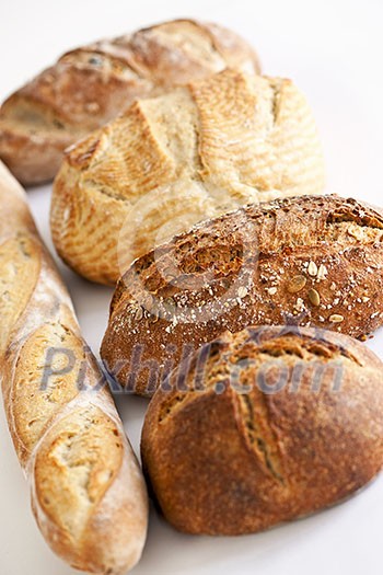 Assorted kinds of fresh baked bread in a row Assorted kinds of fresh baked bread in a row