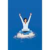 Happy black woman with computer sitting on cloud