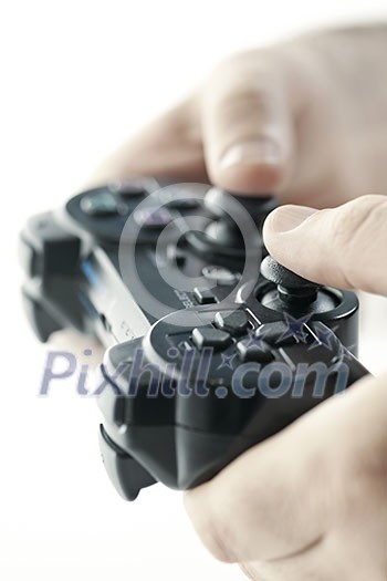 Male hands holding video game controller closeup Male hands holding video game controller closeup