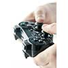 Male hands holding video game controller closeup