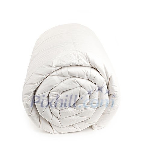 Warm down filled duvet rolled up isolated on white background Warm down filled duvet rolled up isolated on white background